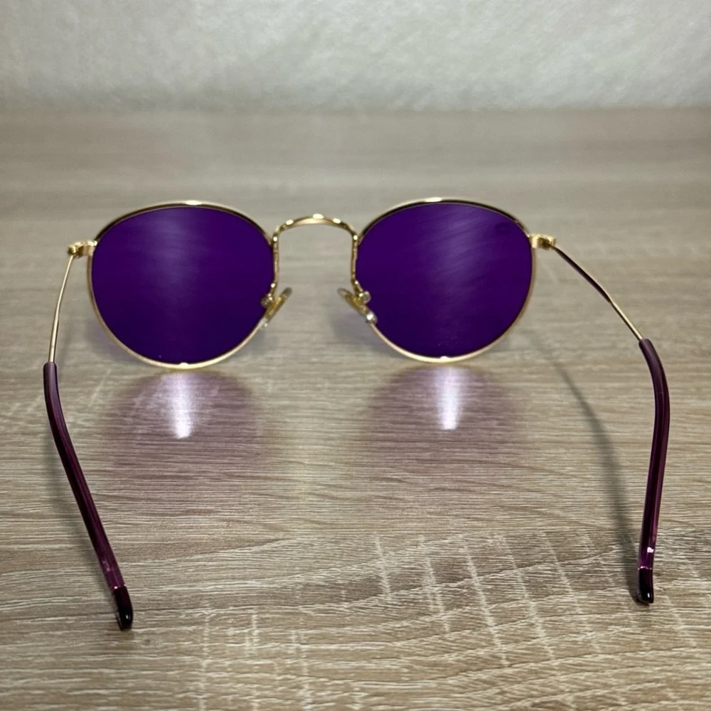 Rainbow OPTX Round sunglasses a gold metal frame and indigo purple lenses